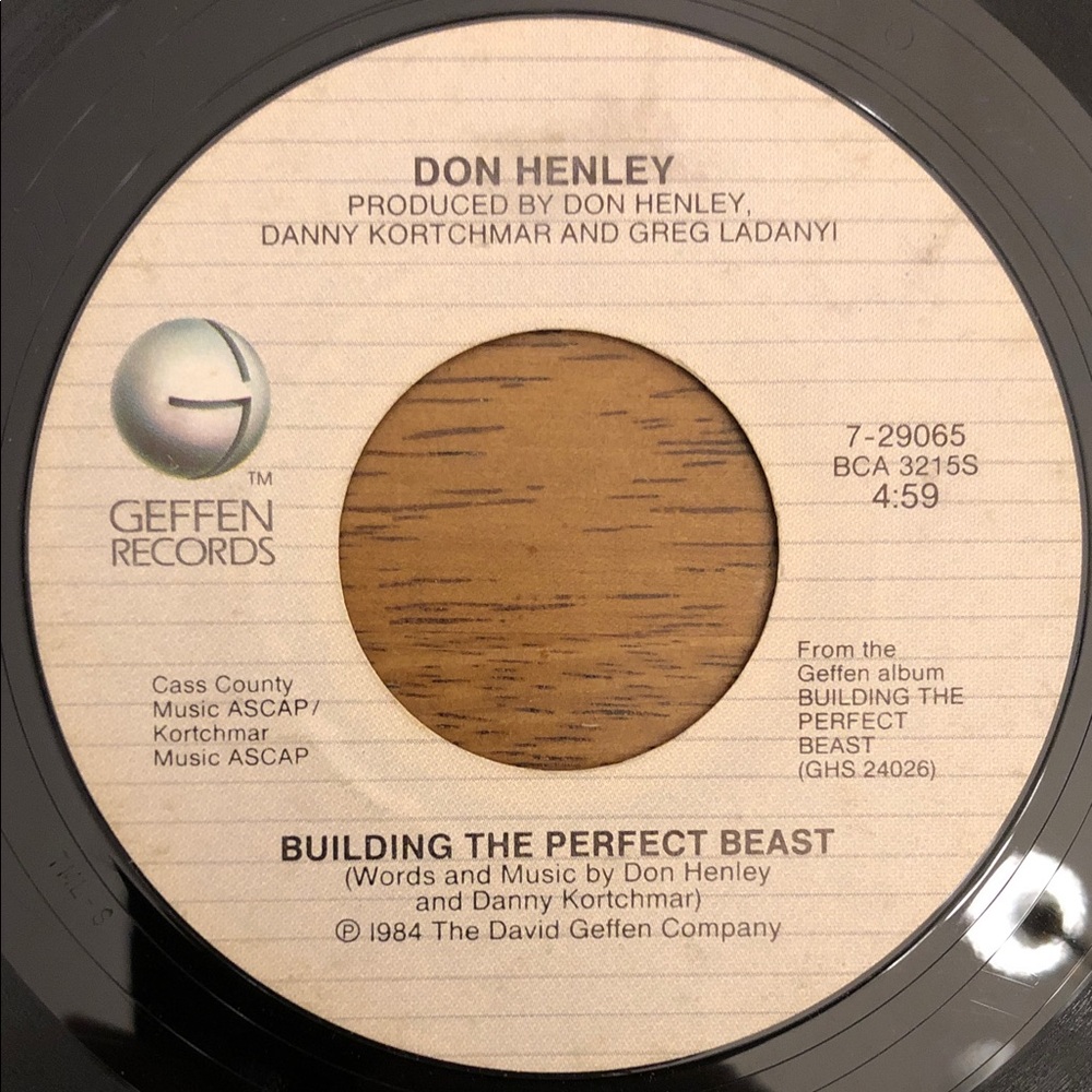 Don Henley Vinyl 45 Record Building the Perfect Beast/All She Wants To Do Is…